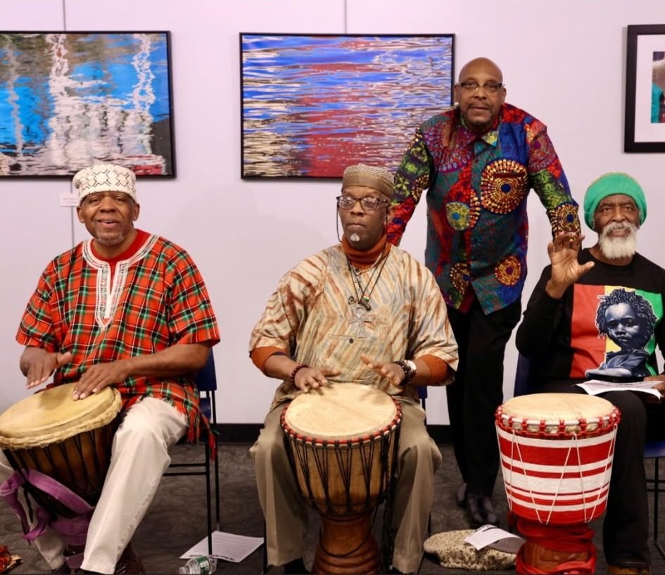 Drummers in traditional dress performing at the CCWW Kwanzaa celebration