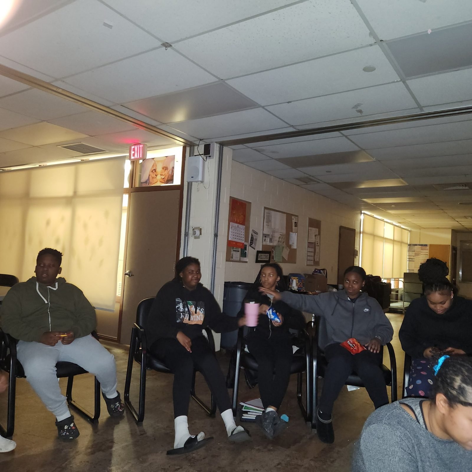 Teens seated in a circle during a group discussion